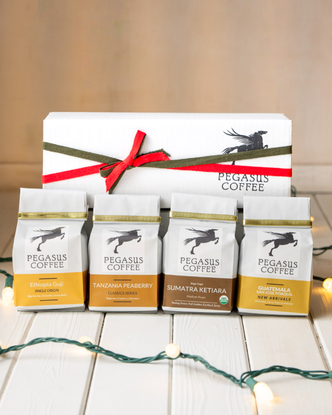 Pegasus Coffee Gift Box in front of ribbon-wrapped box